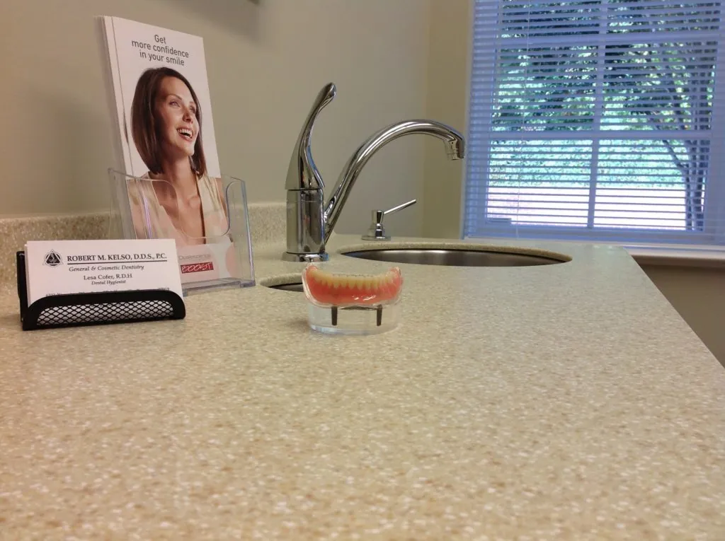 A pair of dentures sitting on a counter are part of the restorative dentistry menu of services at Robert M Kelso DDS in Knoxville TN.