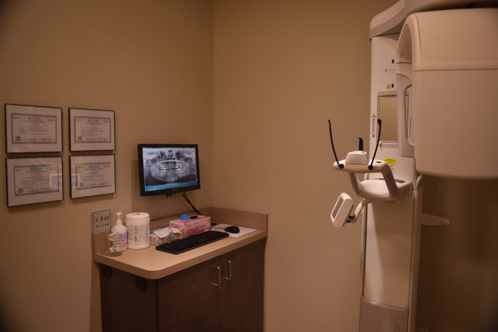 Image of room where patients receive x-rays to add in diagnosis and treatment which are part of the comprehensive general dentistry services.