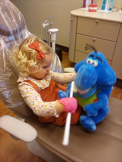 pediatric patient sitting in dental chair at Robert M. Kelso, DDS